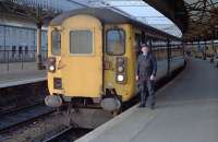 The driver of an Aberdeen-Glasgow train poses by his charge before departure. 47 703 <i>St Mungo</i> was at the rear.<br><br>[Ewan Crawford 25/01/1989]