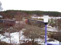 Recovered containers being removed from the crash site at Carrbridge on Saturday morning 13 February 2010. The lorries are using the temporary road laid to provide a direct link between the site and the A9.<br><br>[Gus Carnegie 13/02/2010]