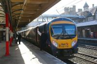 A First Trans Pennine Express service to Preston formed by 185135 calls at Lancaster on 11 February 2010. The guard acknowledges the 'right away' from the despatcher as the train gets ready for the final leg of its journey south.<br>
<br><br>[John McIntyre 11/02/2010]