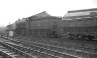 Looking south from Springburn station in 1961 as Gresley K2 no 61764 <I>Loch Arkaig</I> takes a ballast train past the North British Locomotive Co Hyde Park works on the up goods line.<br><br>[K A Gray 03/07/1961]