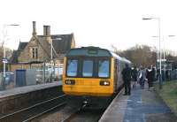 A Manchester to Southport service in the hands of Northern Rail 142005 calls at Appley Bridge late in the afternoon of 10 February 2010. The original station building stands on the Up platform although now in use as the 'Station Bar'.... could be worse..<br>
<br><br>[John McIntyre 10/02/2010]