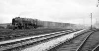 A BR Standard class 9F 2-10-0 hurries past Kingmoor with a freight in the mid 1960s.<br><br>[Robin Barbour Collection (Courtesy Bruce McCartney) //]