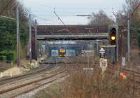 Looking south along the WCML under several bridges as West Coast Railways 47760 breasts a minor summit on the approach to Leyland with an ecs recovery move from Manchester Victoria to Carnforth on 13 February 2010. The train was routed home via Blackburn, Clitheroe, Hellifield and the Little North Western.<br>
<br><br>[John McIntyre 13/02/2010]