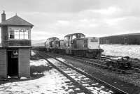 Claytons 8510 and 8586 propelling empty flats towards Newcastleton past the abandoned signal box at Whitrope in November 1969 during tracklifting operations on the Waverley route.<br><br>[Bruce McCartney /11/1969]