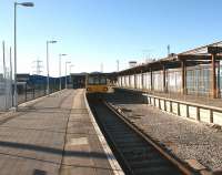 144006 has arrived at Heysham Port on 11 February 2010 on a service from Leeds, via Skipton, Carnforth and Lancaster. This is now the only train that calls at Heysham Port and connects with the Isle of Man ferry, seen in the right background peeping over the platform canopy.<br><br>[John McIntyre 11/02/2010]