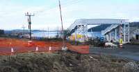 A new footbridge to cross the re-opening line has been installed at the east end of Hillend Reservoir. View looks west.<br><br>[Ewan Crawford 17/02/2010]