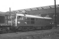 Class 31 no D5852 standing immediately behind D7512 in the shed yard at Saltley in November 1969. 8V66 was the code for the 0320 Normanby Park - Cardiff Tidal Sidings (albeit a few years later than the date of this photograph), so 5852 being an Immingham loco at the time, would fit with such a working.<br><br>[Bill Jamieson 01/11/1969]