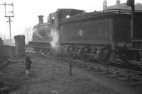 Youthful admiration from one of the photographer's sons for J36 no 65258 as it shunts Gorgie East yard close to the bridge over Gorgie Road in 1961. To the left are the signals controlling the southern approach to Gorgie Junction. The lettering on the bridge reads 'British Railways Gorgie East Passenger & Goods Station'. [See image 4302].<br>
<br><br>[Frank Spaven Collection (Courtesy David Spaven) //1961]