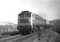 Brush Type 4 no 1972 photographed just west of the site of St Margarets on 28 February 1970, with Meadowbank stadium in the left background.  The train is thought to be the empty stock for the 1440 Edinburgh Waverley - Aberdeen service.<br><br>[Bill Jamieson 28/02/1970]