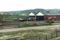 A class 47 (now confirmed to be 47107) and a class 151 prototype 3-car Sprinter set, photographed at Llandudno Junction carriage shed in May 1991.<br><br>[David Pesterfield 04/05/1991]