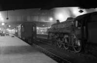 Evening scene at Carlisle station looking north in the mid 1960s. BR Standard class 5MT 4-6-0 no 73005 is standing on one of the centre roads.<br><br>[Robin Barbour Collection (Courtesy Bruce McCartney) //]