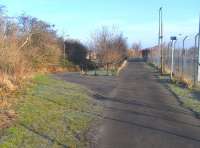 Crew was an old toll cottage on the Ferry Road until the area started to become built up between the wars and the name acquired a final 'e', probably through association with the Cheshire town, as if its more rational spelling had been wrong all along.The junction on the CR Leith branch however retained the old spelling until the end. The site is pictured here on 20 February 2010. Left for Granton Goods, right for Leith North. The red footbridge visible through the mesh fence is on the site of the short-lived bridge photographed by Frank Spaven in 1966 [see image 26659]. <br>
<br><br>[David Panton 20/02/2010]