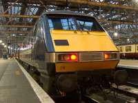 East Coast Railways 91129 at Platform 2 of Glasgow Central on 6th February 2010 after arriving with a service from London Kings Cross. In the background, the traincare crew go into action to get the train ready for the return journey.<br><br>[Graham Morgan 06/02/2010]