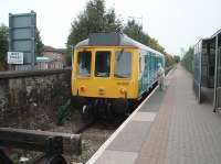 A local resident sees her friend off from Cardiff Bay, chatting through the open droplight window right up to departure.  The shuttle service runs one mile to Cardiff Queen St [See image 25492], situated by the tower block that can be seen above the end of the platform. No apologies for another picture of the Arriva <I>Bubble Car</I> 55032 as it has so much more character than the Pacers and Sprinters used on today's network.<br><br>[Mark Bartlett 18/09/2009]