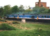 Looking south as 50024 <I>Vanguard</I>+50050 <I>Fearless</I> in <I>Network SouthEast</I> livery pass Oakenshaw Junction on 23 April 1988. The locomotives are heading towards Hare Park Junction hauling the <I>Fellsman</I> special on its return from Carlisle to Taunton via Sheffield and Birmingham. The spur climbing up to join the Midland main line at West Riding Junction can be seen in the left background to the front of the leading locomotive.<br><br>[David Pesterfield 23/04/1988]