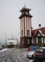 CalMac's <I>MV Argyle</I> prepares to leave a snowy Wemyss Bay for Rothesay, overlooked by the railway station's magnificent clock tower. <br><br>[Mark Bartlett 25/02/2010]