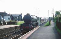 Gresley V2 2-6-2 no 60882 about to pass through Joppa station with an ECML train bound for Waverley on 8 August 1959, as somebody's kid brother looks on in admiration.<br><br>[A Snapper (Courtesy Bruce McCartney) 08/08/1959]