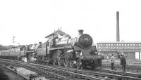 <I>'Sew with Dewhurst's 'Sylko' machine twist'</I> urges the message along the front of Dewhurst's Bell Vue Mill on 28 July 1968, as the MRTS/SVR <I>Farewell to BR Steam</I> special poses for photographs at Skipton. The train, which originated at Birmingham New Street,  had been hauled here from Carnforth by 75019 + 75027 and would shortly be taken forward by  45073 + 45156 on the next stage of the tour as far as Rose Grove. The Mill, which at one time employed 2000 people, finally ceased production in the 1980s and was later converted to residential apartments. <br>
<br><br>[K A Gray 28/07/1968]