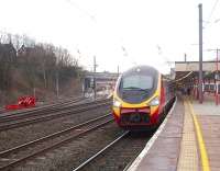 390035 is on time at 0830 at Lancaster on the 0539 from Euston on 25 February. The Pendolino was running with the nose cover open but the train also arrived a few minutes ahead of its 1036 schedule in Glasgow Central. Over on the opposite side the of the station the substantial buffers on the Platform 5 catch points can be seen protecting the main line from unauthorised departures. <br><br>[Mark Bartlett 25/02/2010]