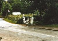 Prestonhall level crossing on the disused Auchmuty branch, since converted to a walkway. Undated photograph. <br><br>[David Panton //]