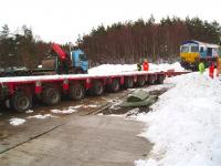 Eight weeks to the day since it left the rails at Carrbridge, class 66 locomotive no 66048 is about to be hauled onto a low loader before being taken to Inverness for partial dismantling, prior to being shipped to Derby for further attention.<br><br>[Gus Carnegie 01/03/2010]