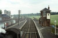 Looking north east over a standard class 2 2-6-0 at Kelso on Saturday 13 June 1964 during its lengthy 24 minute wait with the 4.2pm St Boswells - Tweedmouth train. This was the last scheduled eastbound passenger service over the line. [See image 30110]<br><br>[Frank Spaven Collection (Courtesy David Spaven) 13/06/1964]