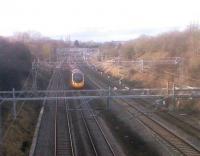 Ancient and modern: the LNWR is clearly thriving here, although the station platforms (which were on this side, or south, of the road bridge just visible in the background) have been demolished - likewise the Stratford-on-Avon and Midland Joint overbridge, which ran crossways above the fourth coach of the London-bound Pendolino.<br><br>[Ken Strachan 26/02/2010]