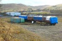 Scene at Tebay on 1 March 2010, looking over the formation of the old NER route to Kirkby Stephen, with the WCML in the background. Here stand the last survivors of the former LMS Liverpool - Southport emus. Introduced in 1939 and latterly classified 502, these units boasted air operated doors, not unlike those used on the 303 sets in Glasgow some 20 years later. <br>
<br><br>[John McIntyre 01/03/2010]