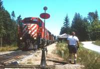 The daily CP freight shunting at Parksville, junction of the Nanaimo-Victoria 'main line' and the Port Alberni branch line on Vancouver Island in the summer of 1994. Despite years of neglect, and inadequate promotion, most of the main line and the branch survive to this day as a 'short line' type operation.<br><br>[David Spaven //1994]