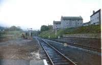 Given the number of station platforms being extended nowadays to cope with longer trains, it is interesting to look back at a time when a different policy applied. The photograph shows Largs in 1986, where the considerable work involved in shortening the platforms (which used to extend to the signal gantries) has almost been completed.<br>
<br><br>[Colin Miller //1986]