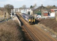 View north at Blackrod, between Chorley and Bolton, where there was a triangular junction with the line to Horwich station and the Horwich works of the Lancashire & Yorkshire Railway. Class 150 unit number 272 calls at the station on 2 March with a service for Hazel Grove. The signal box (still in use) can just be made out through the footbridge and stands next to the northern part of the old triangle. The southern junction to Horwich may have been to the right of the goods shed. The rapid expansion of railways in this part of the world in the mid to late 19th century is well reflected in the names carried by this station between 1841 and 1888 which were Horwich Road, Horwich and Blackrod, Horwich Junction, Horwich and Blackrod Junction and finally Blackrod.<br><br>[John McIntyre 02/03/2010]