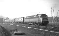 Train 1E83, the 14.20 Edinburgh Waverley - Newcastle Central, passes between the site of the old St Margarets shed and the new Meadowbank stadium on 28 February 1970, hauled by Brush Type 4 no D1761 (the'D' prefix was in the process of being phased out at that time but notevery depot had completed the painting over). A 19th century relic of 64A gives some foreground interest.<br>
<br><br>[Bill Jamieson  28/02/1970]