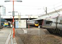 A busy period at Warrington Bank Quay on 3 March 2010 as an Arriva Trains Wales Llandudno - Manchester Piccadilly service waits at platform 4, a northbound Pendolino arrives on Platform 3 and a southbound Pendolino to Euston arrives at Platform 2. Out of sight on Platform 1 is a 2 car Class 150 waiting to return to Liverpool Lime Street with a shuttle service.<br>
<br><br>[John McIntyre 03/03/2010]