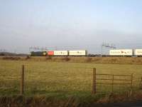 Freightliner 90046 heads north near Rugeley on 26 January, with <I>Hamburg Sud</I> containers predominant at the front of the train.<br><br>[David Pesterfield 26/01/2010]