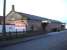 The former railway goods shed at Ashbourne in December 2009. Now surrounded by major new developments all around but still in use with a new company sign at the south west corner of the building.<br><br>[David Pesterfield 10/12/2009]