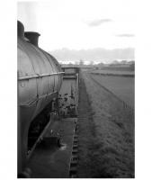 Looking west from the cab of J38 no 65915 returning tender-first from Leslie to Markinch with the daily goods in the early 1960s [see image 23788]. The train is passing through the eastern part of Glenrothes. The earthworks in the right background carry the present day A92 and the houses of Laverock Avenue stand beyond. The Leslie branch was closed in 1967 and this part of the trackbed is now a footpath.<br><br>[Robin Barbour Collection (Courtesy Bruce McCartney) //]