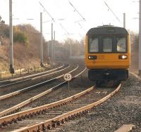 The Bare Lane to Hest Bank chord only has two daily scheduled services but 142095 is captured here joining the main line on the 1619 Morecambe to Leeds service, which avoids Lancaster. However, <I>Duchess of Sutherland</I> looked (and sounded) more impressive than the Pacer from the same, but nowadays inaccesible, lineside viewpoint [See image 23906].<br><br>[Mark Bartlett 05/03/2010]