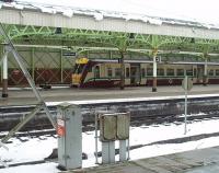 Sitting at the Wemyss Bay buffers, after arrival from Glasgow Central, is 334005 as seen looking across from the now disused platform that has become a car park. The morning's snow was thawing by this time, as can be seen on the platform canopy, and the noise of dripping water was echoing round the concourse. <br><br>[Mark Bartlett 25/02/2010]