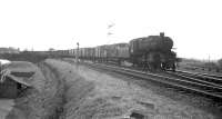 43121 approaches Longtown station with a northbound freight shortly after crossing the River Esk in the mid 1960s. The train is about to pass over the junction with the line to Gretna which turns off to the west behind the locomotive.<br><br>[Robin Barbour Collection (Courtesy Bruce McCartney) //]