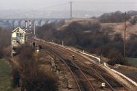 Sunday at Crigglestone Junction in the springof 1974 with the signalbox switched out and signals cleared for the line towards Horbury Junction. The viaduct in the background over the valley of the Blacker Beck was part of an ambitious scheme by the Midland Railway to allow direct running between Sheffield andBradford bypassing Leeds, a project which was never completed. The MRmanaged to construct from Royston Jn. as far asDewsbury along with a connection to the L&Y main line atThornhill in 1905/6, but the very expensive section north to Bradford(it would have included a tunnel almost three miles long underBradford) was never started. <br>
<br><br>[Bill Jamieson //1974]