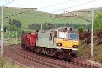 92014 south of Abington with a Mossend - Chirk log train in May 2000.<br>
<br><br>[Bill Roberton /05/2000]