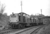 A pair of Claytons with D8610 leading D8616, which had earlier worked down to Granton, seen here returning past Trinity Junction complete with brakevan on the way back to Millerhill in March 1970. Grantonhad been operated as a single line since the start of 1970, when all signalboxes beyond Easter Road Junction were abolished, hence the locomotives apparently running 'wrong line'. <br>
<br><br>[Bill Jamieson 16/03/1970]