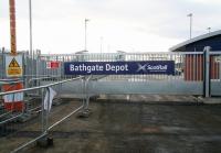 Entrance to the new First ScotRail depot at Bathgate on 14 March 2010. Looking east towards Edinburgh with the main line on the left. The lift towers and footbridge of the under-construction Bathgate station can be seen in in the background.<br><br>[John Furnevel 14/03/2010]