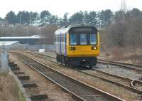 The early afternoon Blackpool South to Colne service passes the CE sidings at Bamber Bridge on 14 March 2010 in the hands of 142051. The former direct line to Preston via Todd Lane ran off to the right behind the unit.<br>
<br><br>[John McIntyre 14/03/2010]