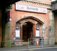 Approaching Burnside station on a Sunday morning, half expecting to hear the strains of Bach's Fugue in A minor coming from the doorway... A distinctly ecclesiastical atmosphere surrounds the eastern entrance to the station, seen here early on 15 April 2007 sandwiched between the bridges on Stonelaw Road.<br><br>[John Furnevel 15/04/2007]