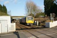 The mid afternoon service from Colne to Blackpool South approaches the AHB level crossing at Hoghton on 14 March 2010. In the background the bridge carries the A675 from Preston to Blackburn road. Until 2009 there were facing and trailing emergency crossovers at this point, however track rationalisation has taken place and it has been plain lined in both directions.<br>
<br><br>[John McIntyre 14/03/2010]