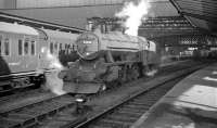 Stanier 8F no 48283, snow-plough fitted and sporting a 55A Holbeck shed plate, stands on the middle road at Carlisle in the 1960s. <br><br>[K A Gray //]