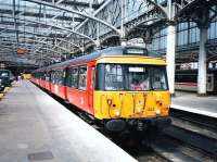 The driver appears to have left the house in a hurry that morning as he has clearly picked up his daughter's bag. 303 008 pulls out of platform 11 at Glasgow Central with a service for Gourock on 2 June 1997. <br>
<br><br>[David Panton 02/06/1997]