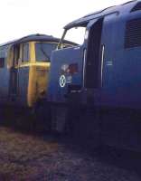 Western D1019 and Hymek D7089 on the scrap line at Swindon Works on 16 March 1974. Both had been withdrawn the previous May but the Hymek (which is clearly in better condition here) was later removed from the works yard for departmental service as train heating unit ADB968005. This was only for a brief period but the loco didn't return to Swindon, being broken up at Thomson's in Stockton in late 1975 or early 1976. D1019 only lasted a few more months and was cut up at Swindon in October 1974. (With thanks to Peter Todd and Crinan Dunbar). <br>
<br><br>[Mark Bartlett 16/03/1974]