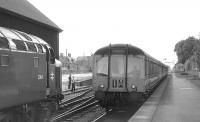 Scottish Grand Tour no 11 headed by D364 pauses at Nairn to <br>
cross the 14.35 Inverness - Aberdeen (single unit leading) on 5th <br>
September 1970 [with thanks to David Spaven]. <br>
<br><br>[Bill Jamieson 05/09/1970]